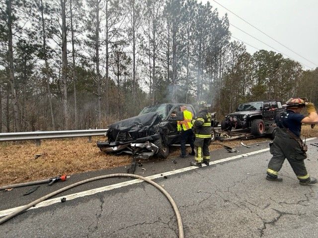 Accident involving truck and trailer with Jeep